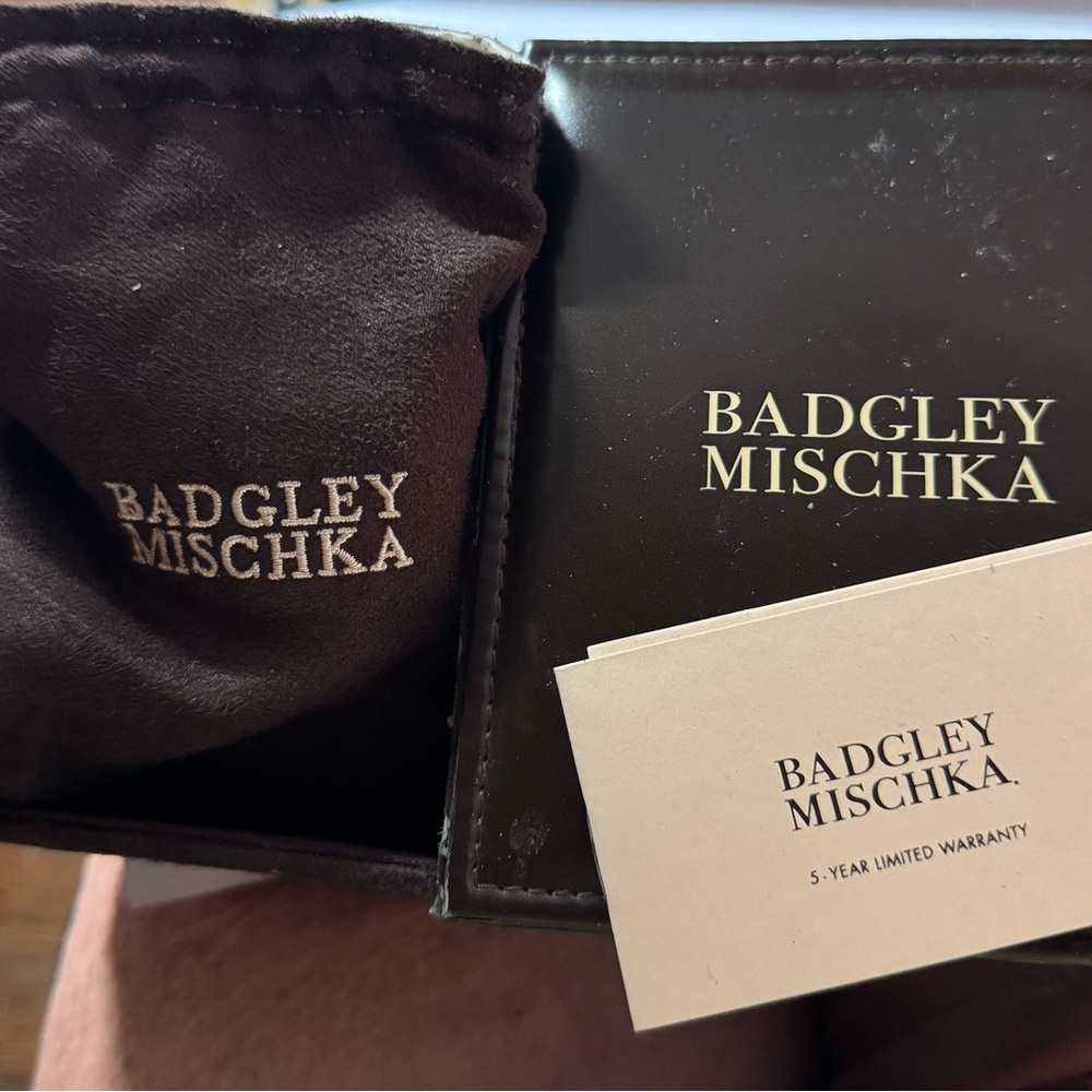 Badgley Mischka Box with a pink leather watchband with white sparkle